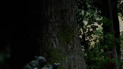 Bodycam squad moving through a dark forest under fire